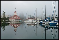 Boats and historic Coronado boathouse in fog. San Diego, California, USA (color)