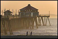 Beachgoers and Huntington Pier, late afternoon. Huntington Beach, Orange County, California, USA ( color)