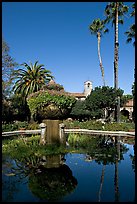 Palm trees reflected in central  courtyard basin. San Juan Capistrano, Orange County, California, USA (color)