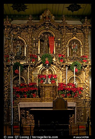 350 year old retablo made of hand-carved wood with a gold leaf overlay. San Juan Capistrano, Orange County, California, USA