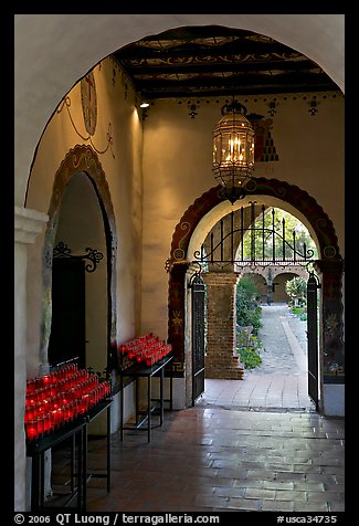 Corridor with candles next to the Serra Chapel. San Juan Capistrano, Orange County, California, USA