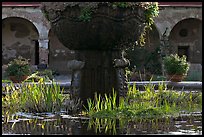 Moorish-style fountain and  courtyard arches. San Juan Capistrano, Orange County, California, USA