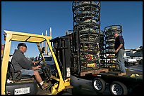 Men loading crab traps onto a truck. Morro Bay, USA ( color)