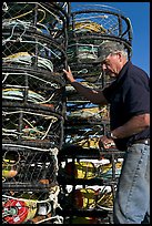 Man loading crab traps. Morro Bay, USA