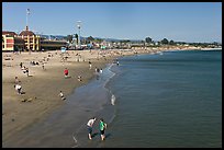 Beach with couple standing in water. Santa Cruz, California, USA (color)