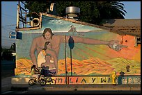 Hispanic girl on bicycle and mural, Alviso. San Jose, California, USA ( color)