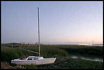 Yacht and marsh at dusk, Alviso. San Jose, California, USA (color)