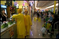 Buddhist nuns in the foot court of the Grand Century mall. San Jose, California, USA (color)