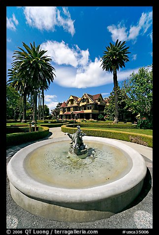 Wide view of fountain and mansion. Winchester Mystery House, San Jose, California, USA (color)