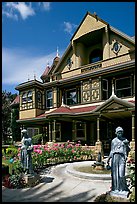 Statues, fountain, and facade. Winchester Mystery House, San Jose, California, USA (color)