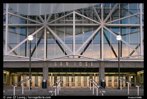 Facade of HP pavilion with San Jose sign reflecting sunset colors. San Jose, California, USA