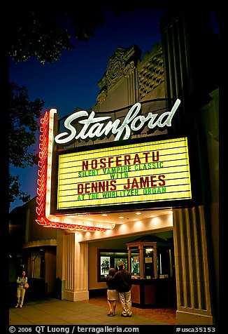 Couple standing in front of Stanford Theatre at night. Palo Alto,  California, USA
