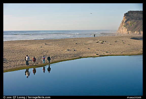 Family walking by lagoon, Scott Creek Beach. California, USA
