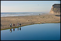Family walking by lagoon, Scott Creek Beach. California, USA