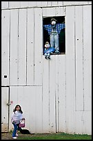 Girl and figures in barn window, Happy Hollow Farm, Rancho San Antonio Park, Los Altos. California, USA