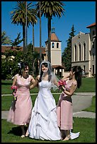 Bride and bridesmaids in front of mission, Santa Clara University. Santa Clara,  California, USA (color)