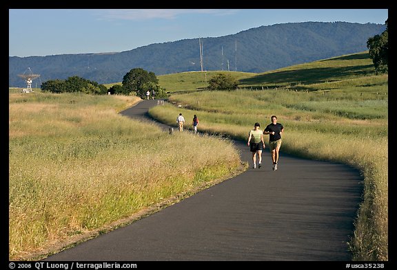 People jogging on trail in the foothills. Stanford University, California, USA (color)