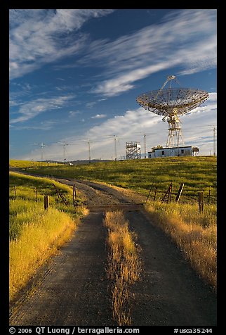 Gravel road leading to parabolic antenna, late afternoon. Stanford University, California, USA (color)