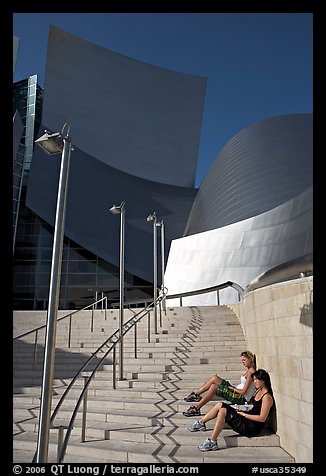Women sunning on the steps of the entrance of the Walt Disney Concert Hall. Los Angeles, California, USA