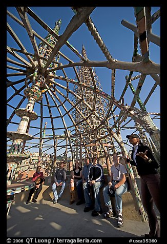 Tour guide and group in the Gazebo of the Watts Towers. Watts, Los Angeles, California, USA (color)