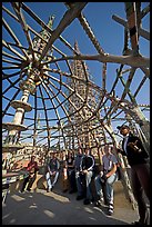 Tour guide and group in the Gazebo of the Watts Towers. Watts, Los Angeles, California, USA (color)