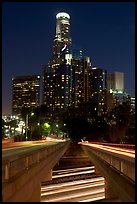 Bridge above Harbor Freeway and US Bank building at night. Los Angeles, California, USA