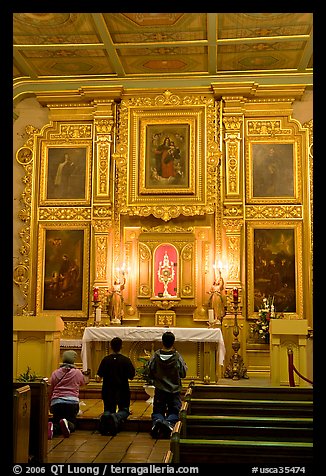Prayer at altar in Mission Chapel. Los Angeles, California, USA (color)