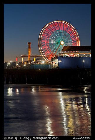 Ferris Wheel in motion at nightfall. Santa Monica, Los Angeles, California, USA (color)