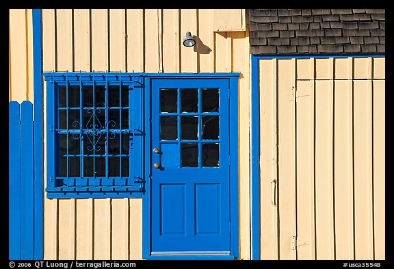 Facade of house with blue doors and windows. Marina Del Rey, Los Angeles, California, USA
