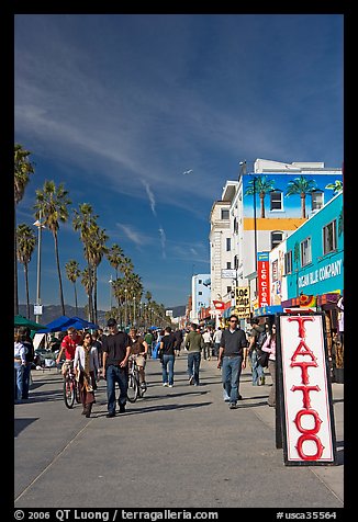 Tatoo sign and colorful Ocean Front Walk. Venice, Los Angeles, California, USA (color)
