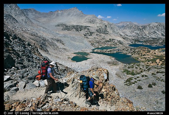Backpackers descending from Bishop Pass, John Muir Wilderness. California, USA (color)