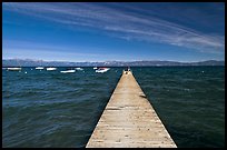 Dock, small boats, and blue waters and mountains, Lake Tahoe, California. USA