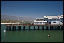 Man on buoy and pier. Santa Barbara, California, USA (color)