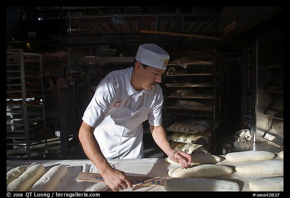 Baker preparing San Francisco sourdough bread. San Francisco, California, USA (color)