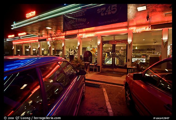 Cars and neon light of dinner at night. San Francisco, California, USA (color)
