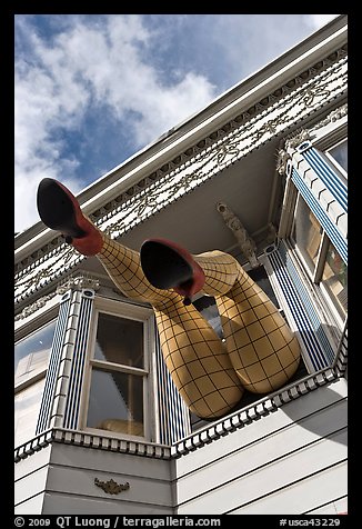 Giant legs with stockings hanging from a second floor, Haight-Ashbury District. San Francisco, California, USA (color)