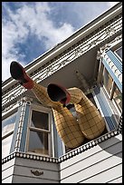 Giant legs with stockings hanging from a second floor, Haight-Ashbury District. San Francisco, California, USA (color)