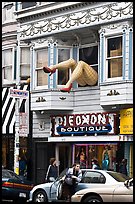 Woman exiting car below women legs with stockings. San Francisco, California, USA ( color)