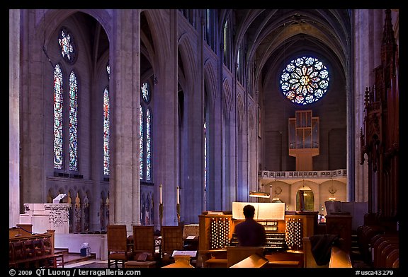 Church organist playing inside Grace Cathedral. San Francisco, California, USA (color)