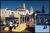 School fair booths and Mission Dolores in the background. San Francisco, California, USA (color)