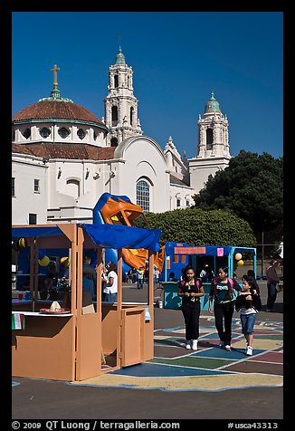School fair booth, children, and Mission Dolores in the background. San Francisco, California, USA