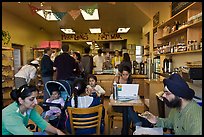 Indian family inside popular pizza restaurant, Haight-Ashbury district. San Francisco, California, USA (color)