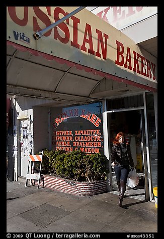 Russian Bakery with redhead woman walking out. San Francisco, California, USA (color)
