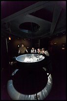 Tourists look at moving image of ocean inside the Camera Obscura, Cliff House. San Francisco, California, USA ( color)