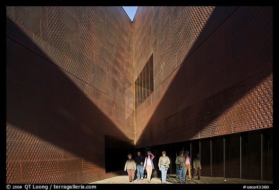Tourists walking out of a striking corner of De Young Museum. San Francisco, California, USA