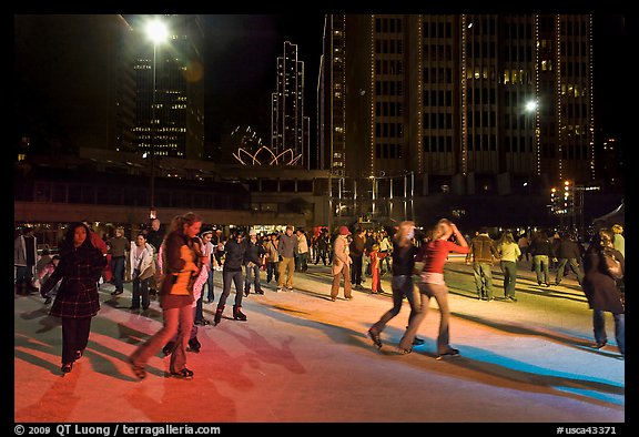 Holiday ice rink at night, Embarcadero Center. San Francisco, California, USA (color)