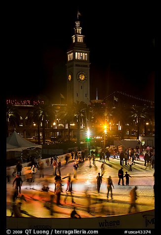 Ice rink and Ferry Building tower at night. San Francisco, California, USA