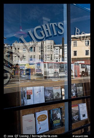 City Light Bookstore storefront with street reflections, North Beach. San Francisco, California, USA (color)