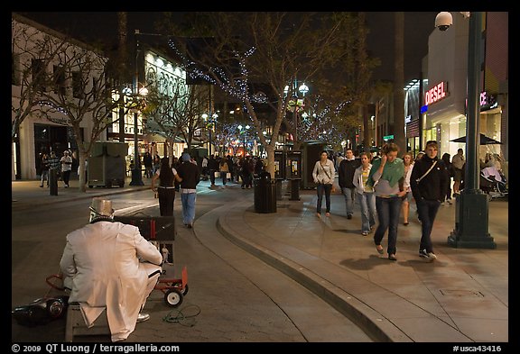 People walking past mime on Third Street Promenade. Santa Monica, Los Angeles, California, USA (color)