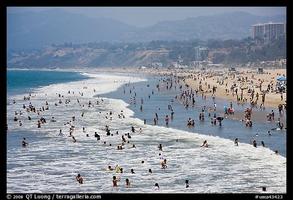 Many people bathing in surf at Santa Monica Beach. Santa Monica, Los Angeles, California, USA (color)